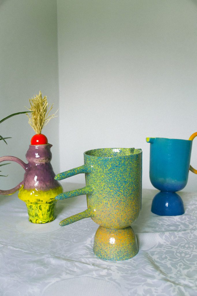 Blue-Cheeked Bee Eater carafe in hand-painted glass, patterned after the bird's plumage
