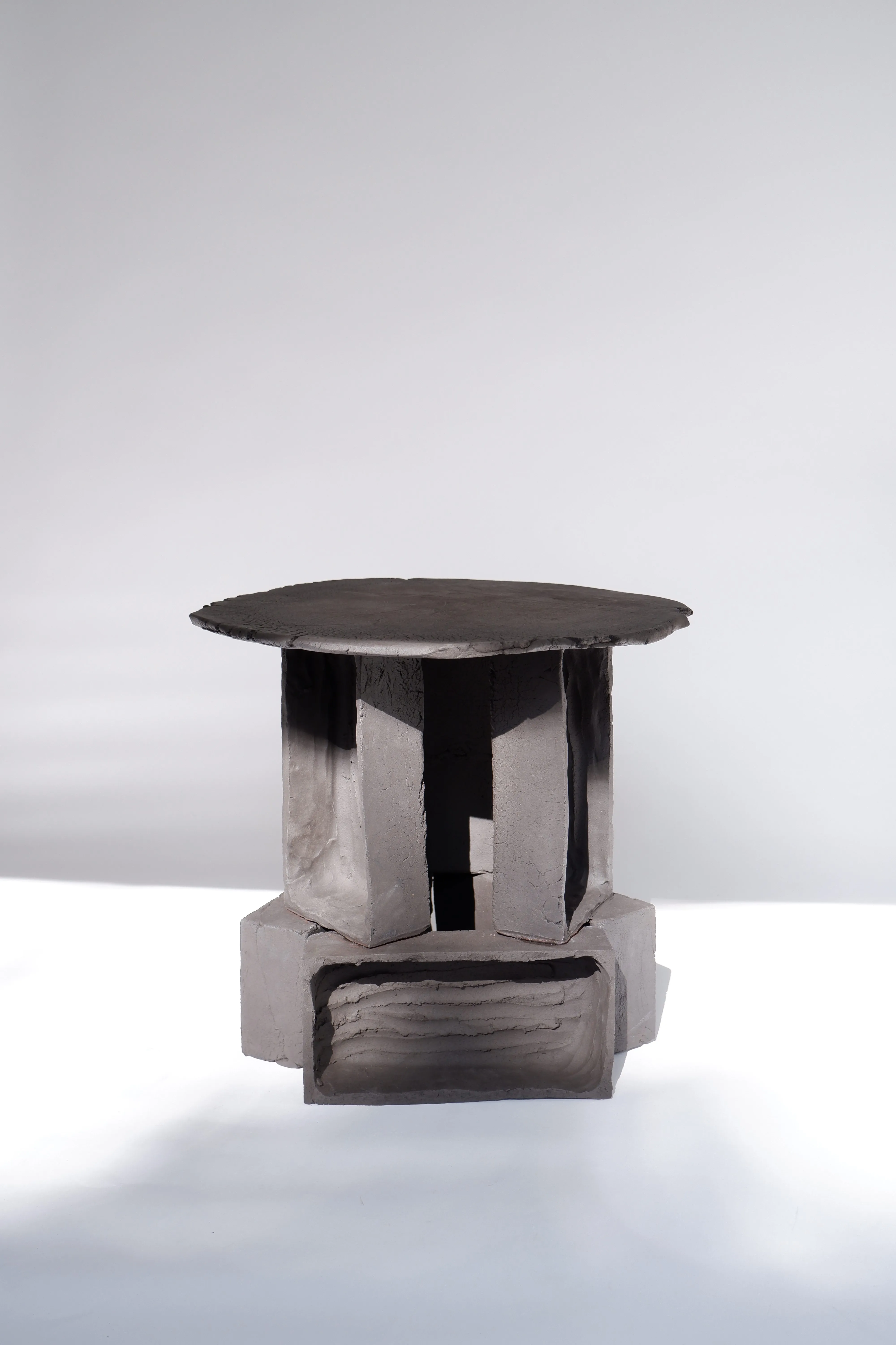 T02 – Black Clay Brutalist Side Tables
by furniture designers Ia Kutateladze 