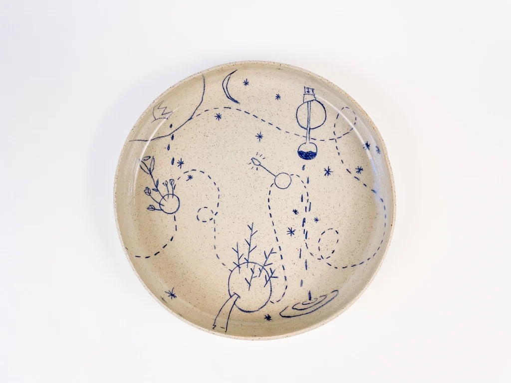 Turchino ceramic plate decorated with underglaze pencil hand-poke tattoo drawings by ccontinua and mamt