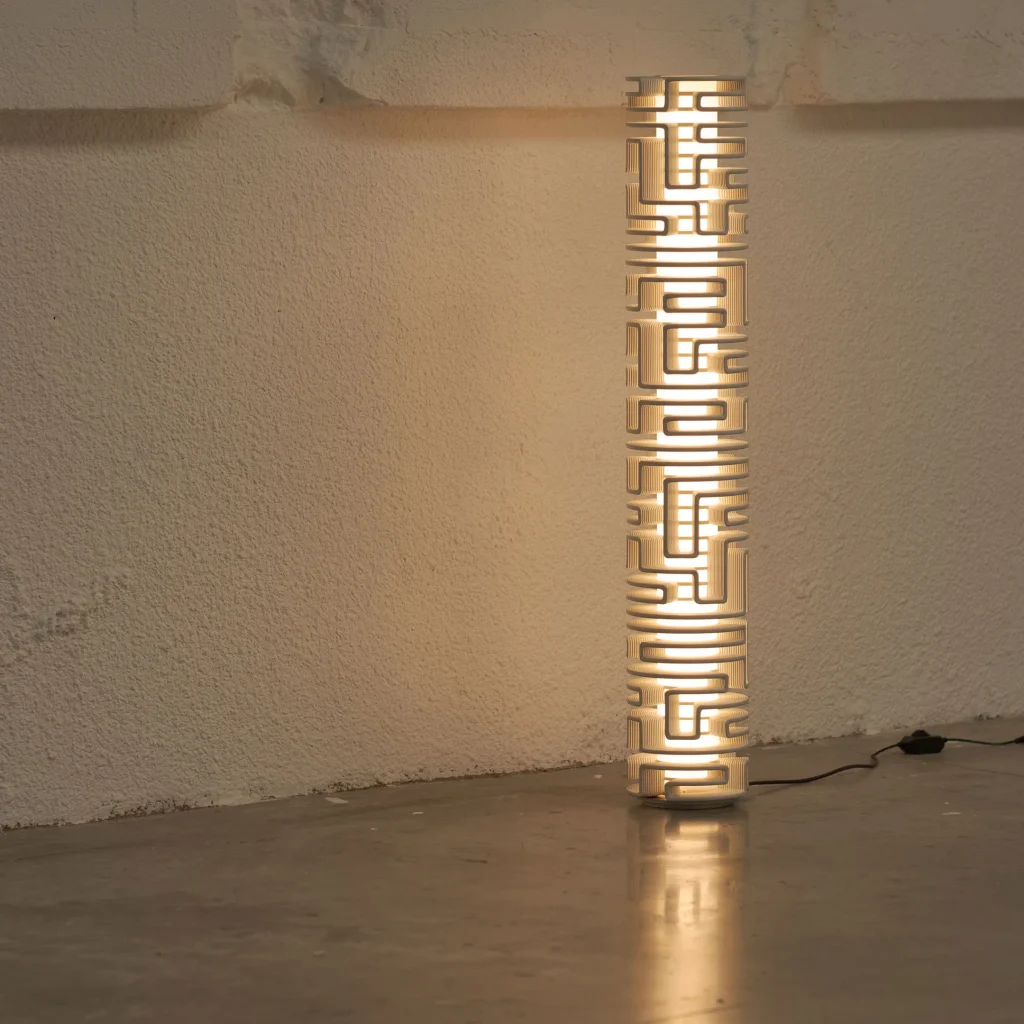 Maze Floorstander Floor Lamp in Recycled Plastic lit in a industrial style room