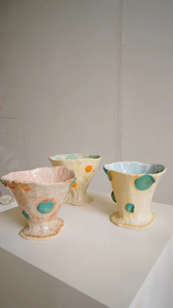 Olé Series tea cups in pastel-glazed ceramic, grouped on a plain surface