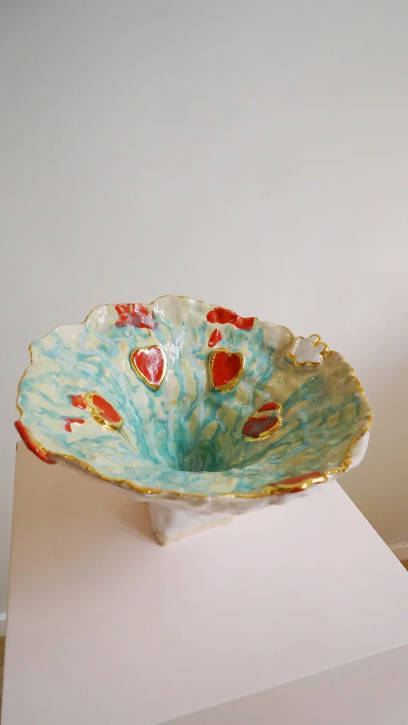 Olé Series plates in pastel-glazed stoneware, stacked on a plain surface