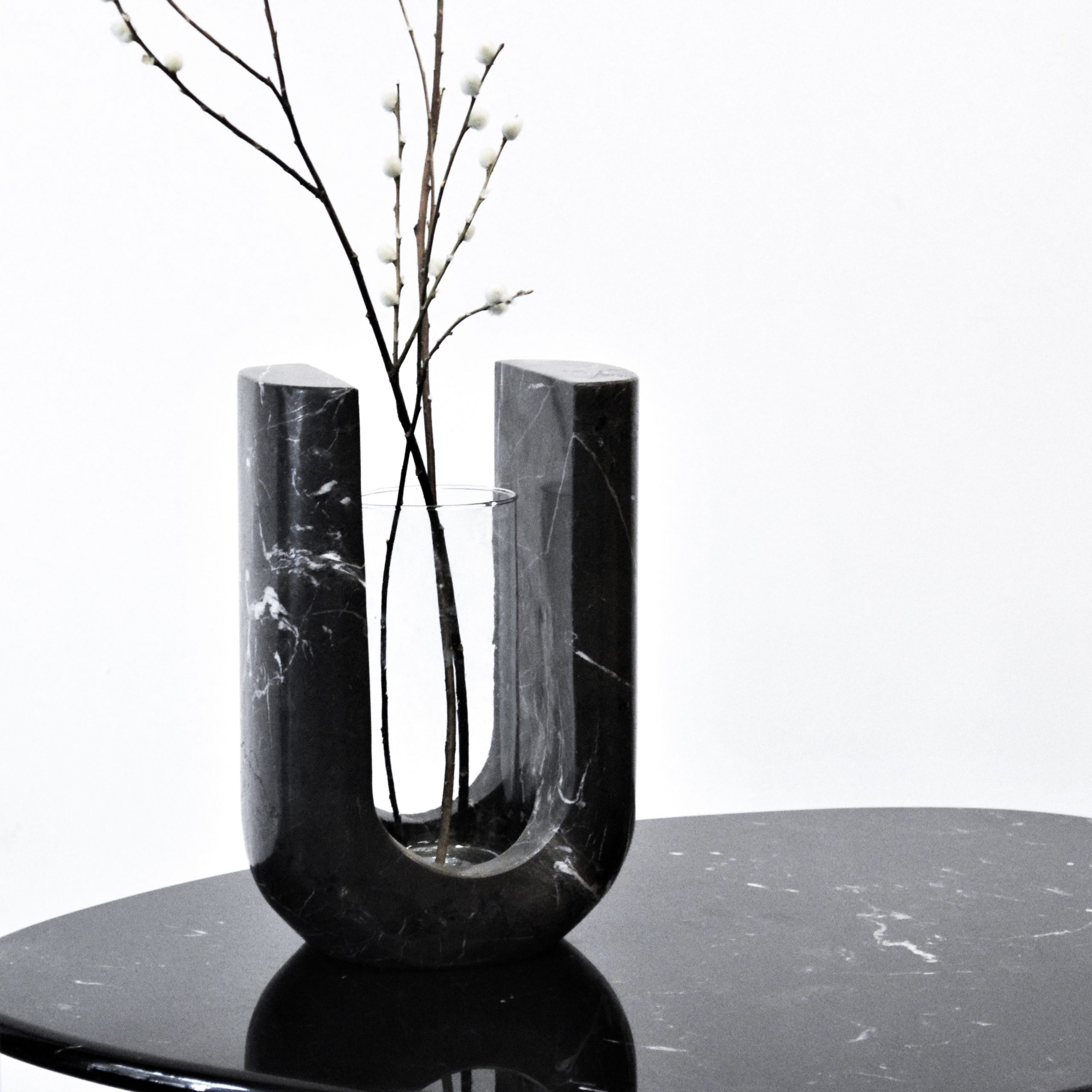 Lago vase carved in marble, blocky and brutalist in mass