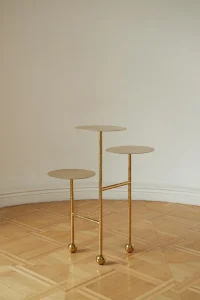 Liquid Pedestal, three round gold tin-coated steel trays on slim rods with ball feet, by FURN OBJECT