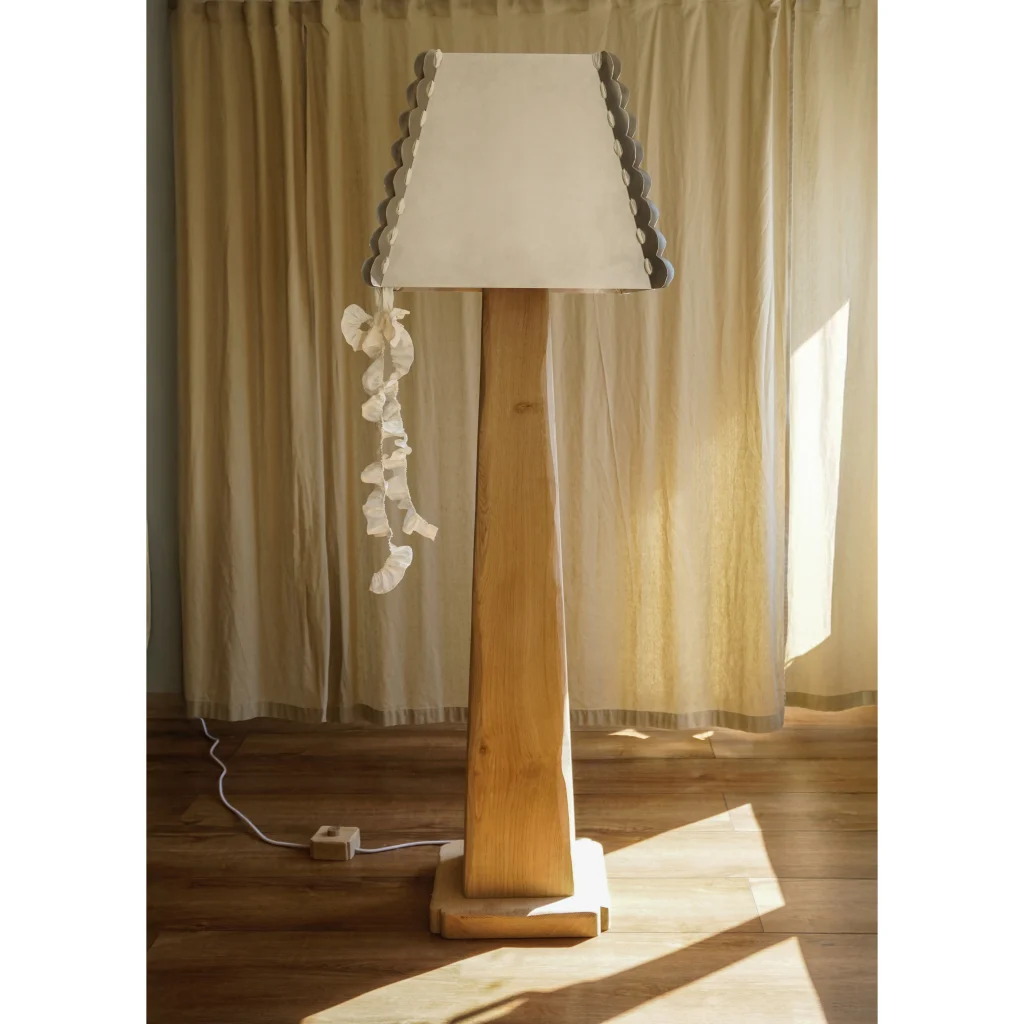 Falbanka Floor Lamp in scalloped aluminum and oak wood, front view.