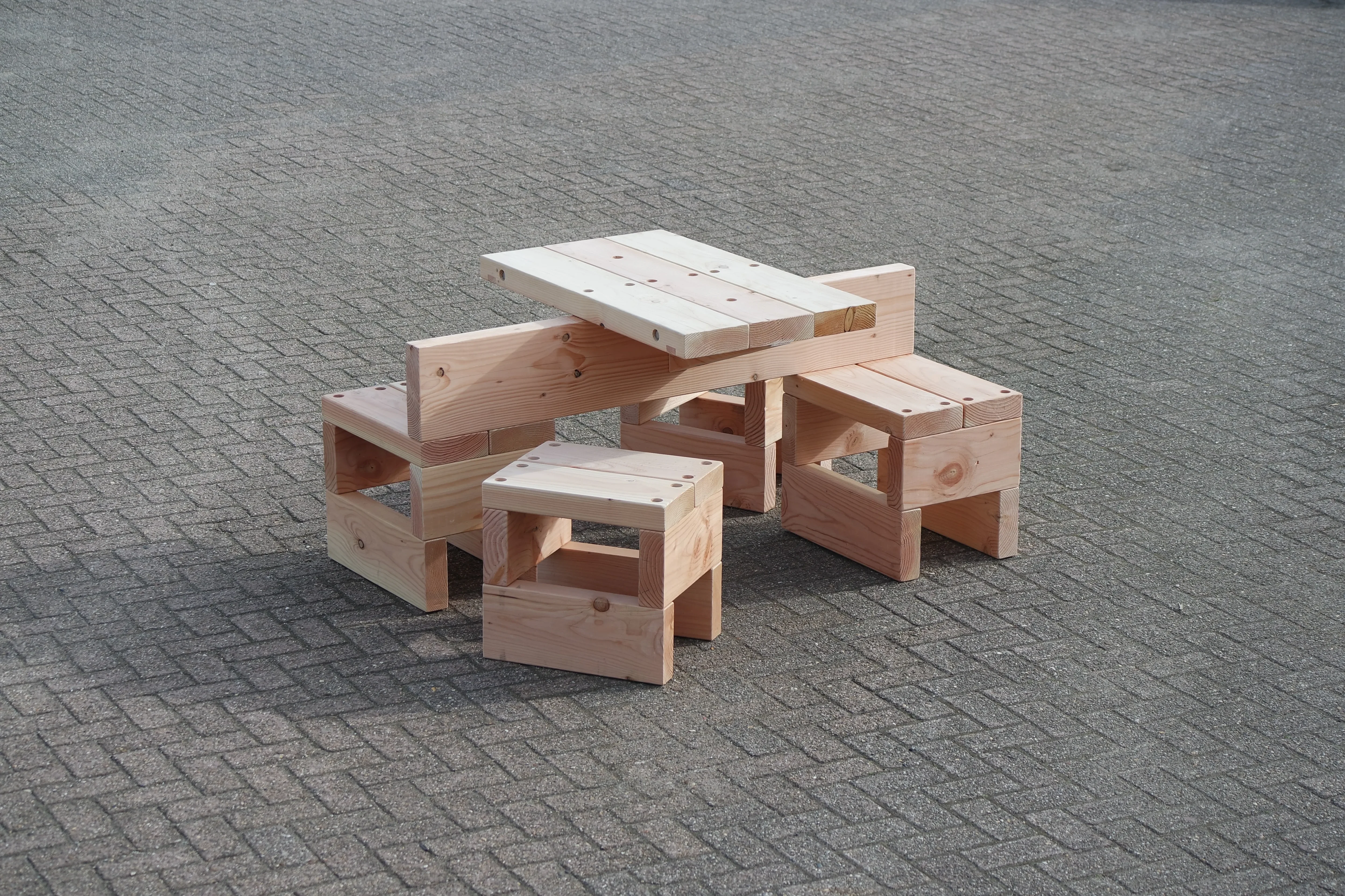 Timber picnic table in stacked Douglas fir beams by Studio Onno Adriaanse