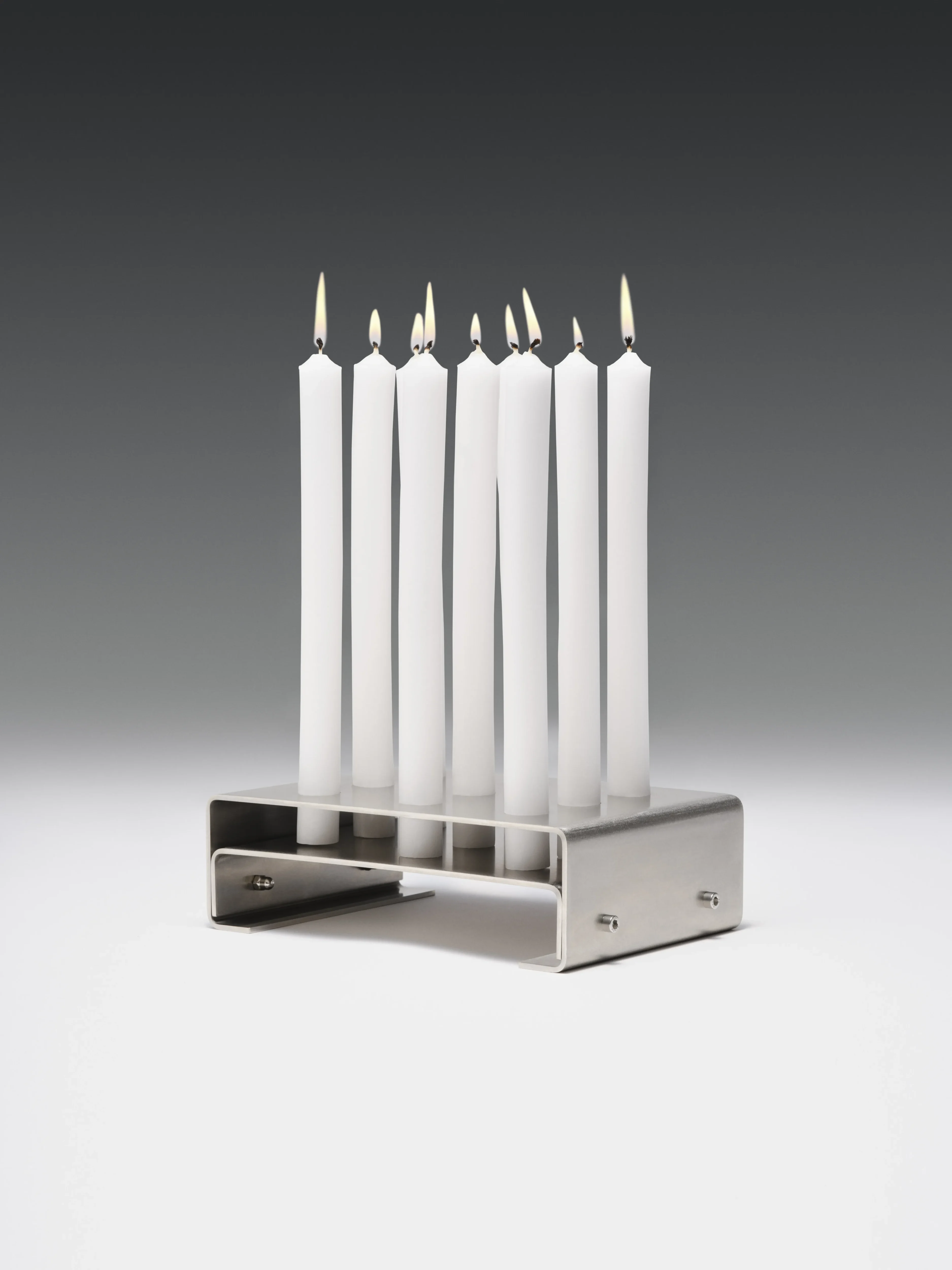 Burning Wing candleholder in folded aluminium sheet by Obscure Objects