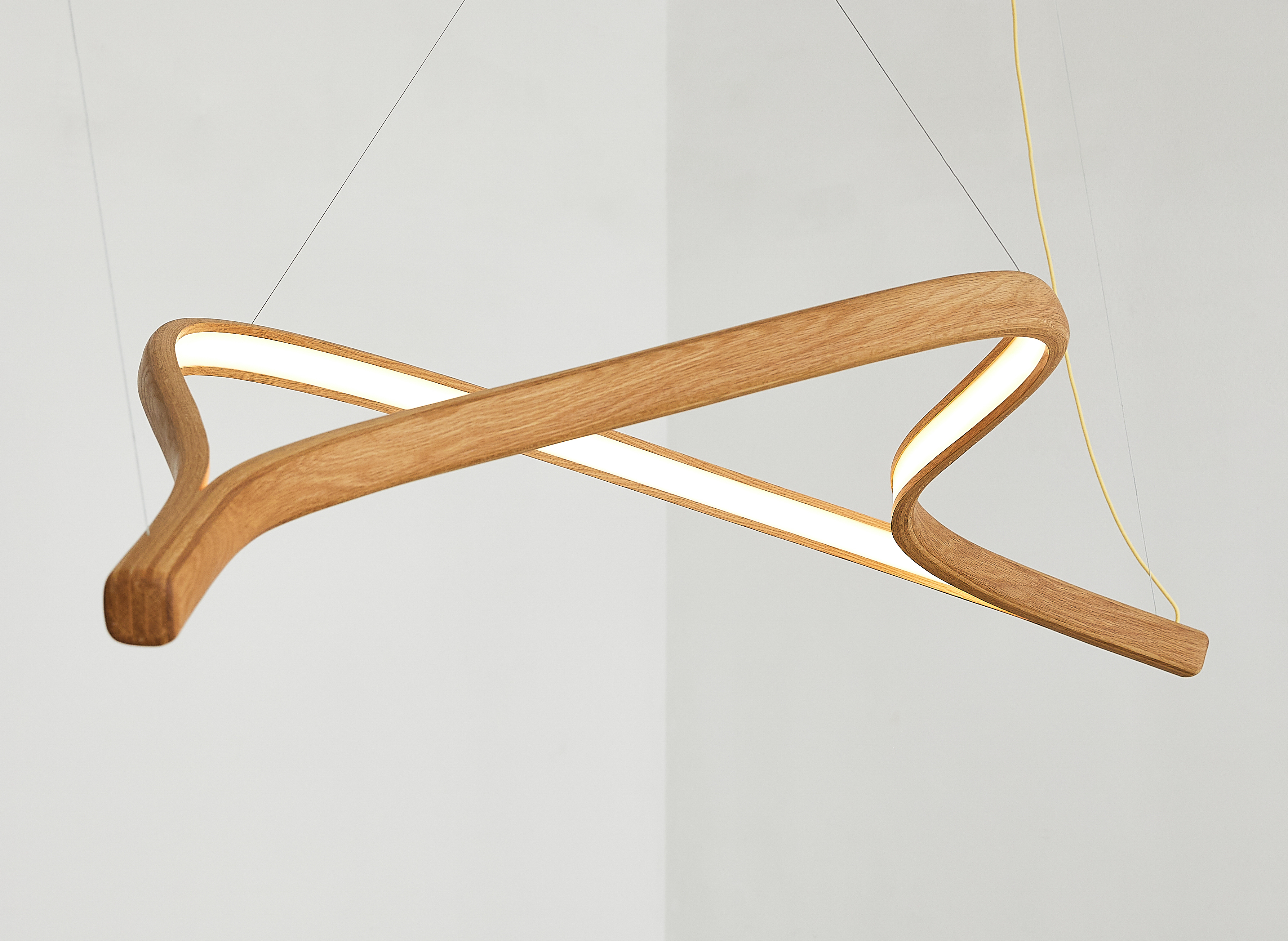 Perola pendant lamp in laminated FSC-certified oak shaped after an oyster shell by Poemia