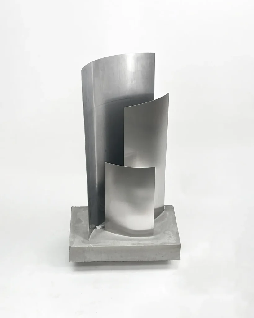 Essenz concrete and brushed stainless steel sculptural floor lamp by case studios