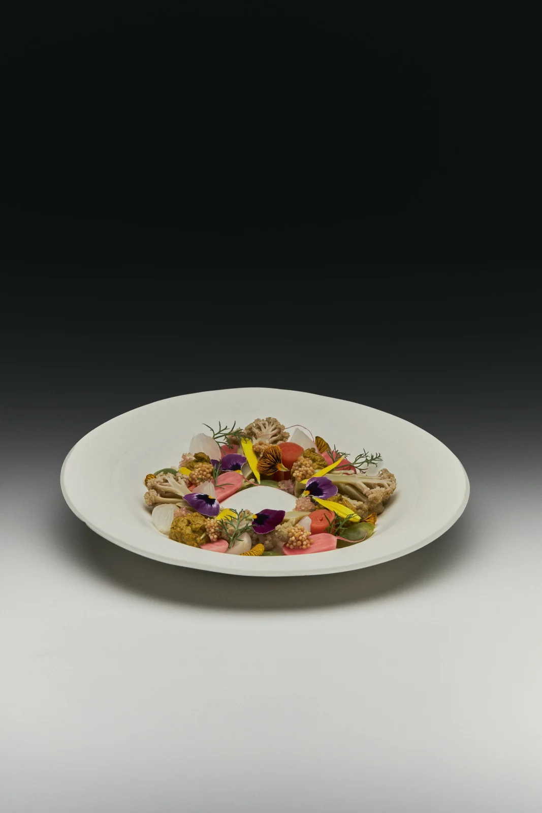 Mendi porcelain plate with an undecorated matte white surface