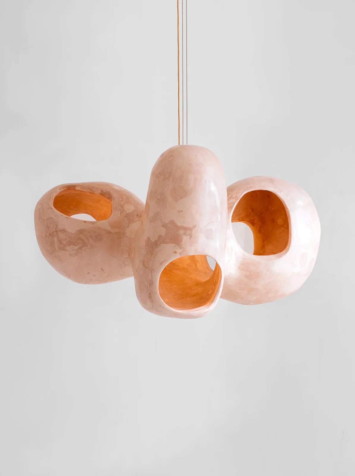 Bosei ceiling lamp with sculptural nude pink gypsum pod forms by Studio AOAO