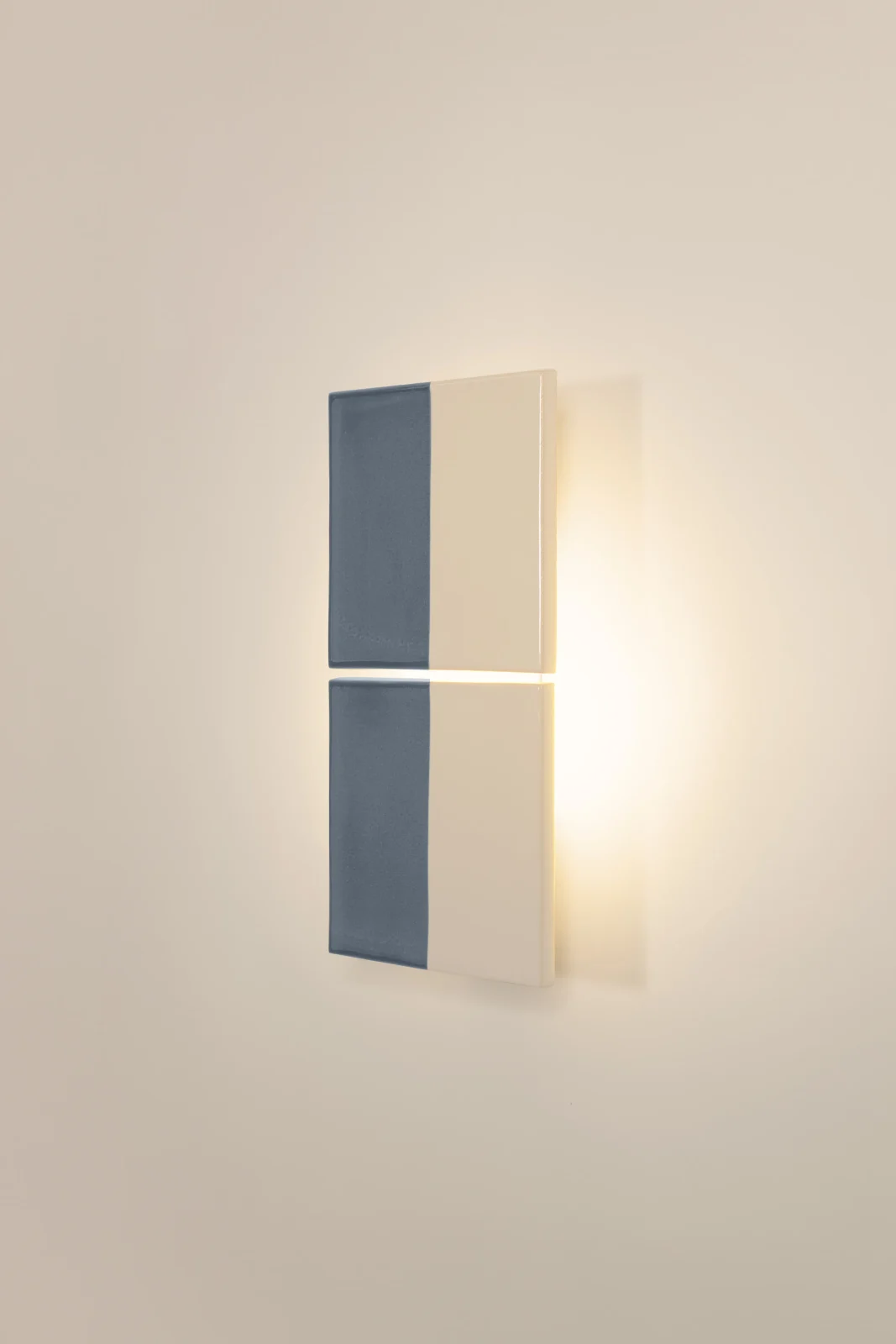 Tiles Line European Wall Sconce in glazed ceramic tiles on a wall, front view.
