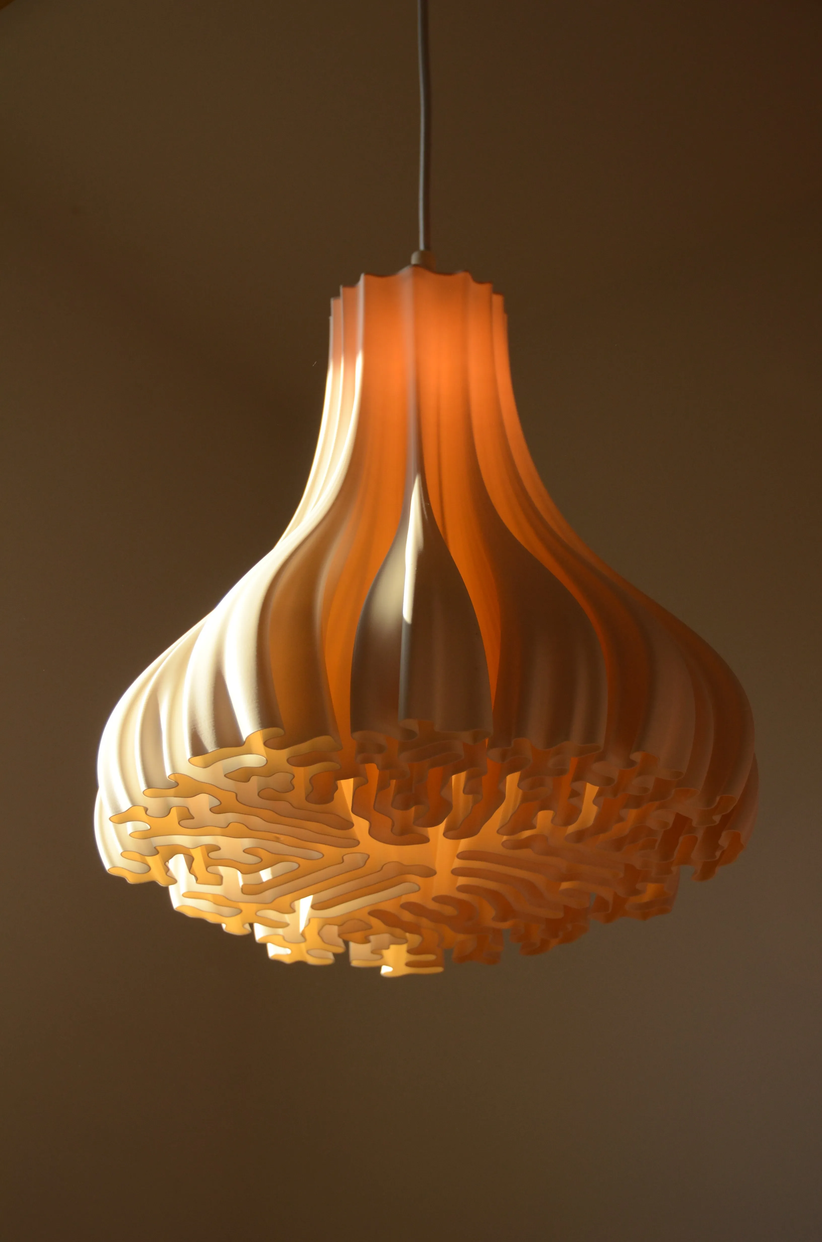 H 3 bio polymer pendant lamp with amber maze-patterned shade