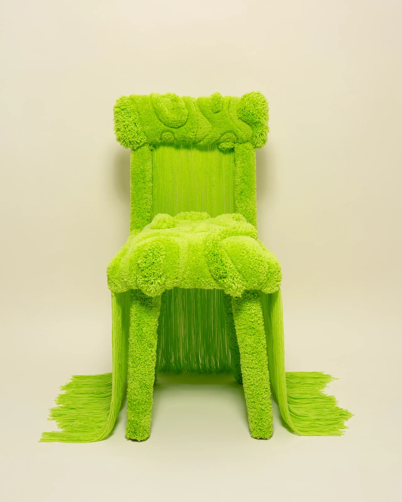 Hand-tufted wool over a sculptural frame in vivid lime