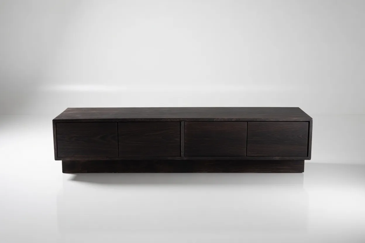 Obsidian low console in shou sugi ban burned solid oak with four doors on a recessed plinth by NO AGE STUDIO