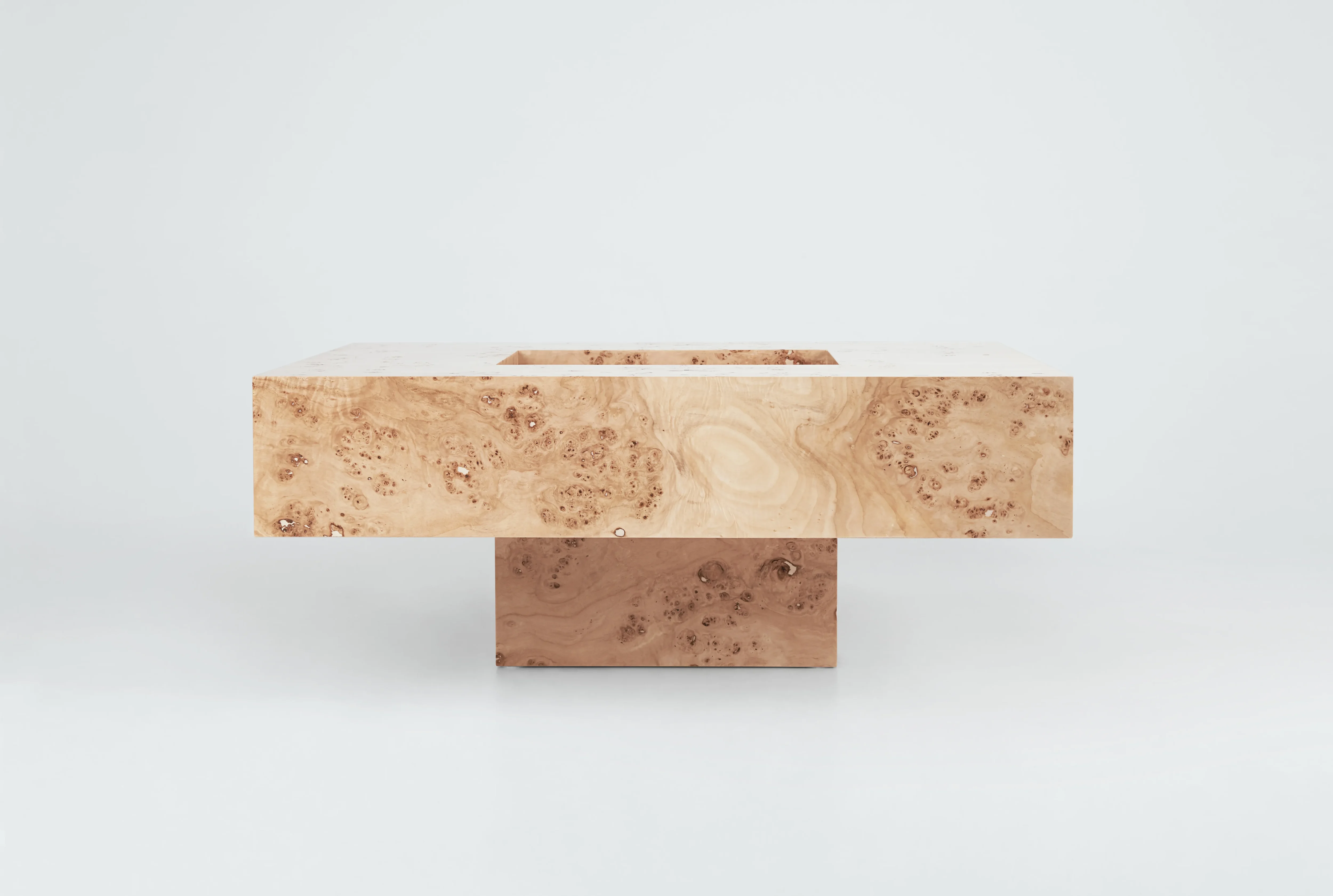 Round poplar burl wood coffee table with a semi-matte finish by Petra Madalena