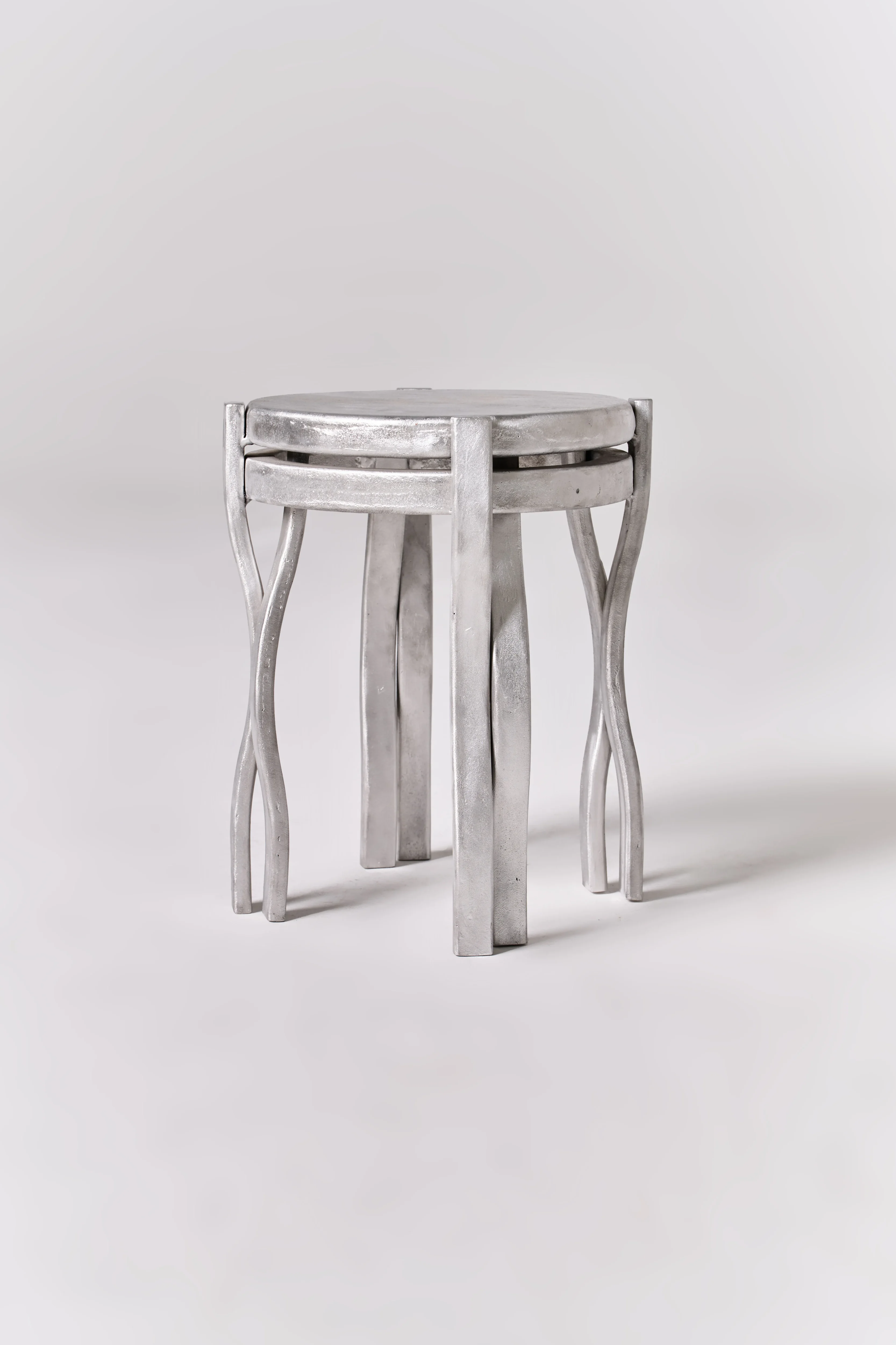 Trama low stool in cast aluminum