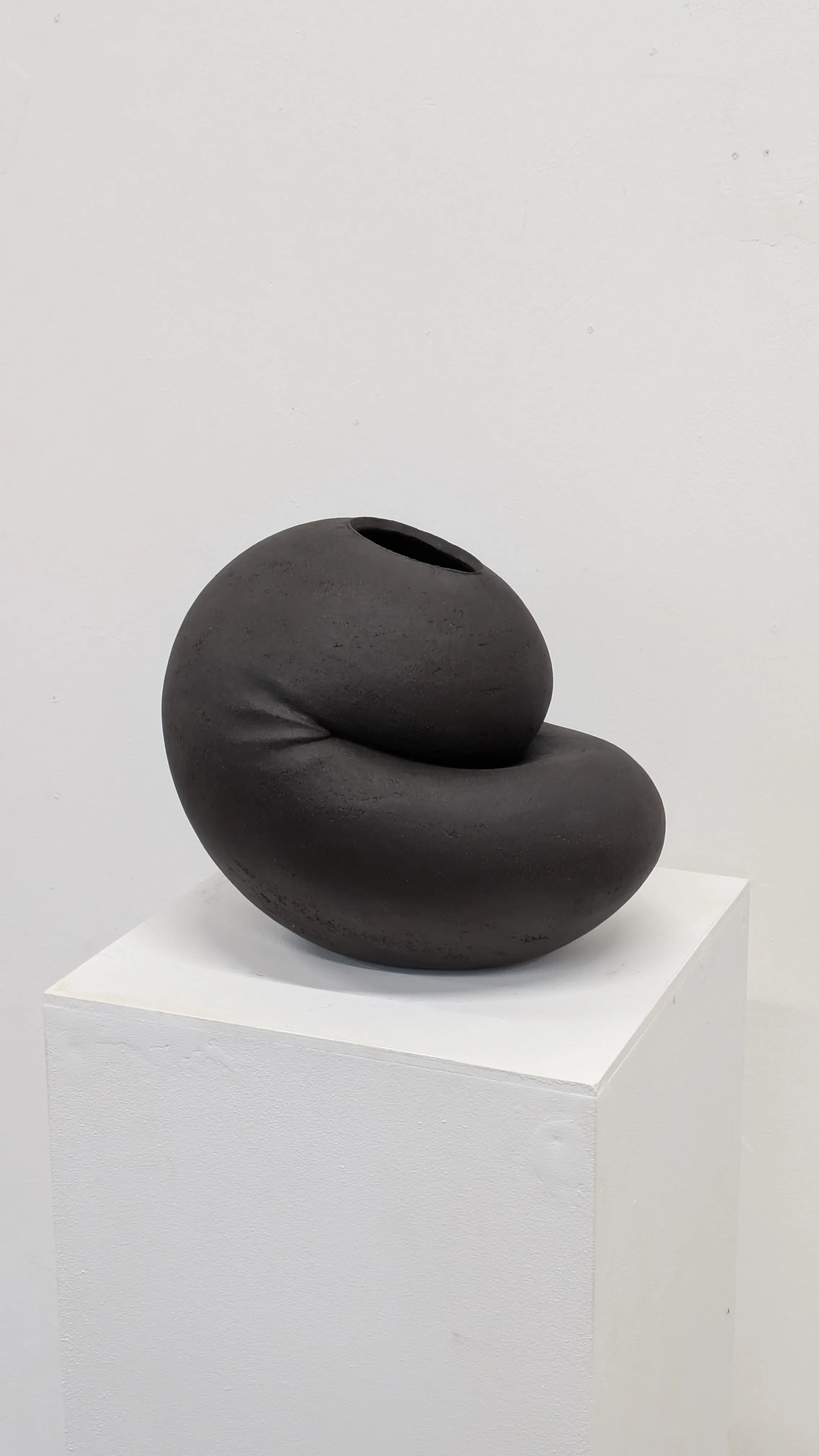 Inwards black sculptural ceramic vessel by Catalin Filip