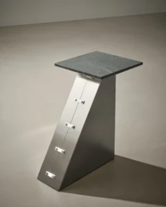 Coraza side table in bent stainless steel with a solid volcanic diabase top by Studio Mohs