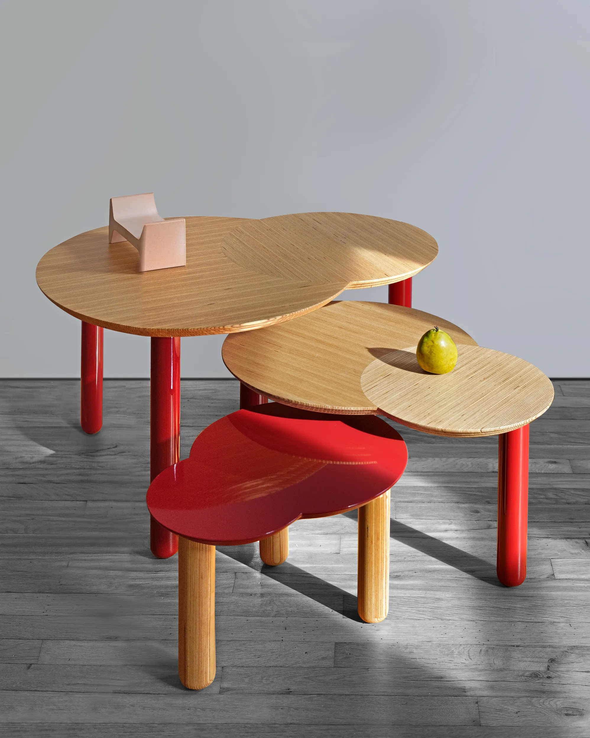 Otto coffee tables in hand-layered end-grain birch and red lacquer with turned legs by SOLMISTUDIO