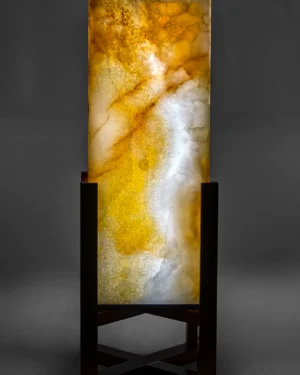 Aurean Table Lamp in ivory onyx and iroko wood on a stand, front view.