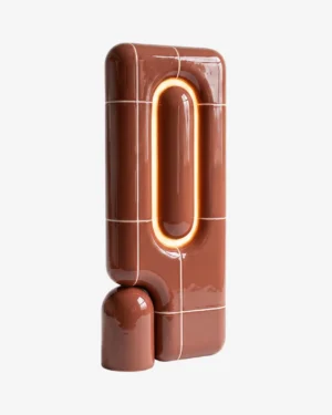 U-037 Table Lamp in Oxide high-gloss PLA on a table, front view.