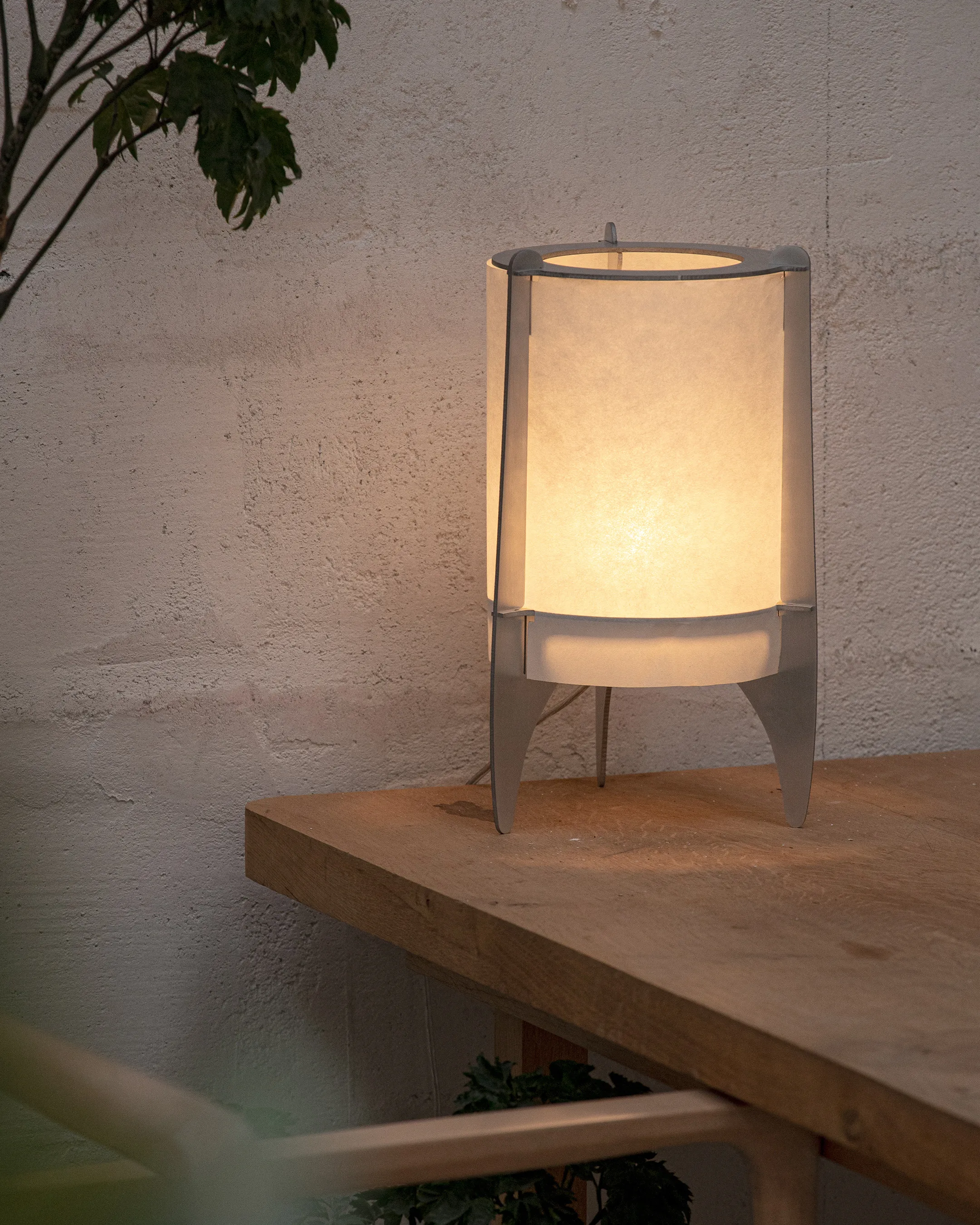 Capsule table lamp with an open aluminum frame and washi paper membrane by Valentine Maurice
