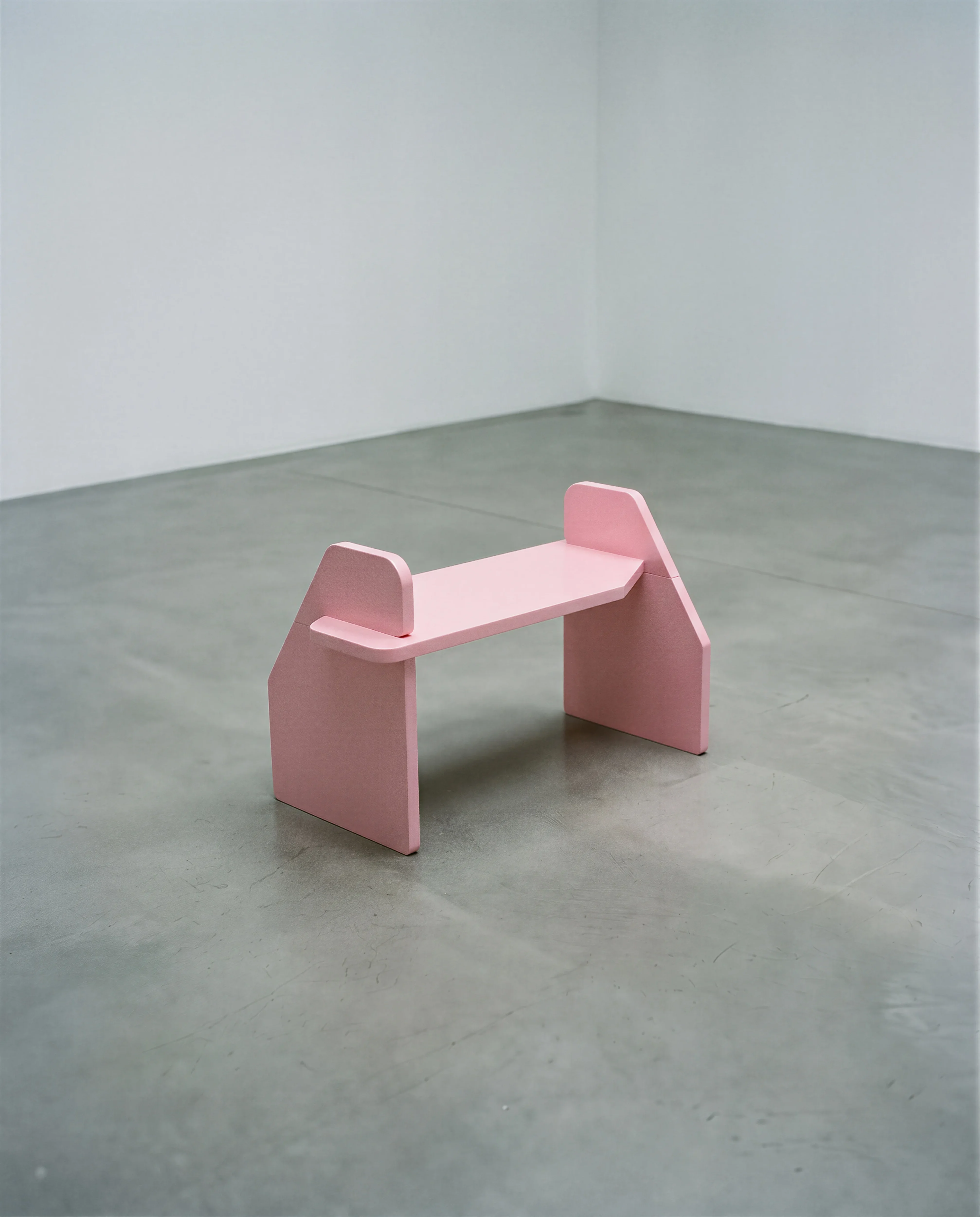 Le Banc pink lacquered bench from the La Planche collection made from recycled wood fiber board by Olive