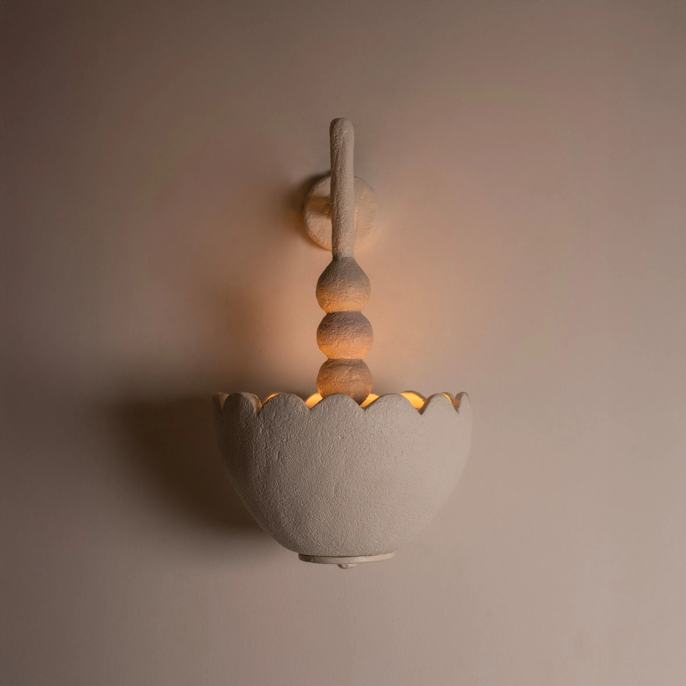 Scallop off-white stoneware wall sconce with a scalloped shade by Harshita Jhamtani Designs