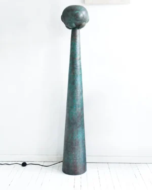 Artefacto Copper Venus Floor Lamp in verdigris hammered copper on a white floor, front view.