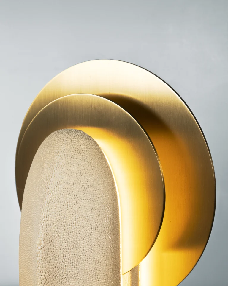 Close-up of the Mother of the Light Table Lamp's textured galuchat body and layered brushed brass discs