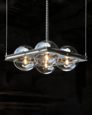 BBL200x04 Pendant Lamp in polished stainless steel and clear acrylic hanging from the ceiling, front view.