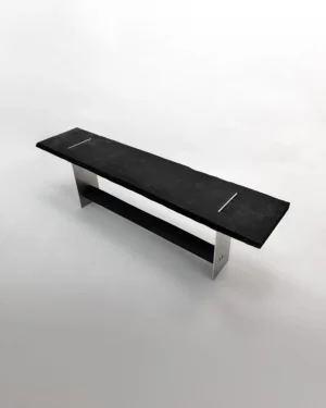 Blackwood Aluminium Bench by case studios, black oak seat on brushed aluminum legs, on a plain background