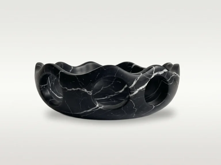 Lava Sun Bowl by Studio Ayres in black marble with thin white veins, scalloped rim and round cutouts