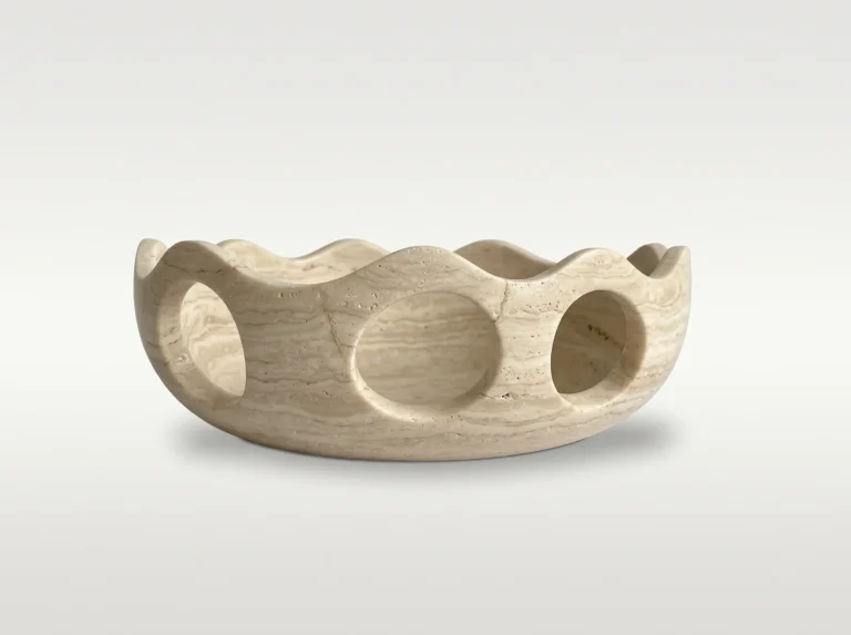 Lava Sun Bowl by Studio Ayres in beige travertine with soft horizontal banding, wavy rim and round openings
