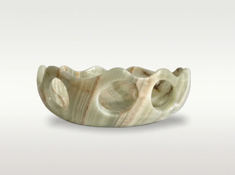Lava Sun Bowl by Studio Ayres in pale green onyx with brown veining, wavy rim and round openings