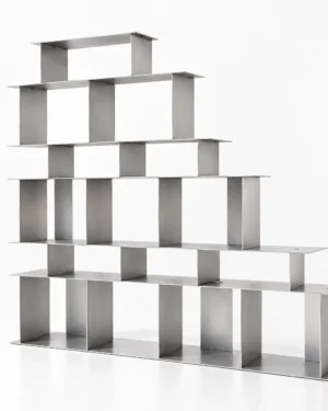 Open Grid Shelves by 301 Design Studio, stepped aluminium shelving unit on a plain background