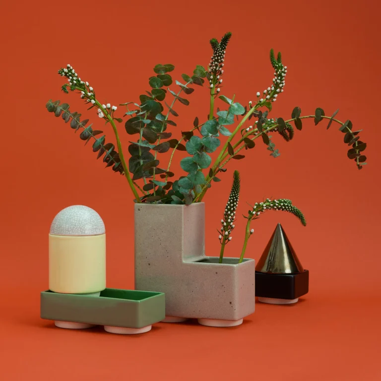 Knstrkt Set Of 6 With Large Pieces by Studio Berg, blocks used as a vase holding eucalyptus and flower stems