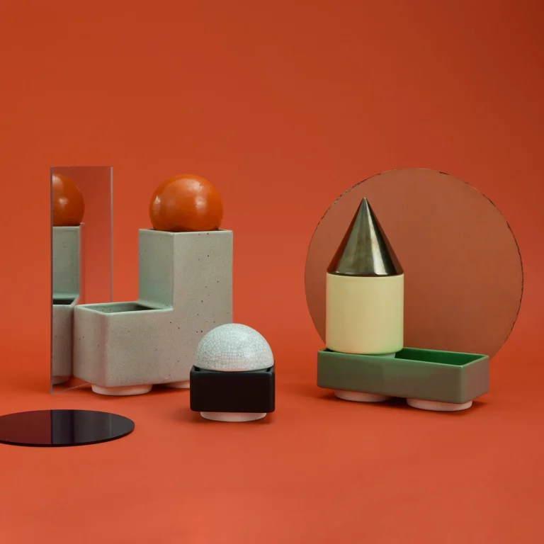 Knstrkt Set Of 6 With Large Pieces by Studio Berg, blocks arranged with a round bronze mirror and an orange sphere