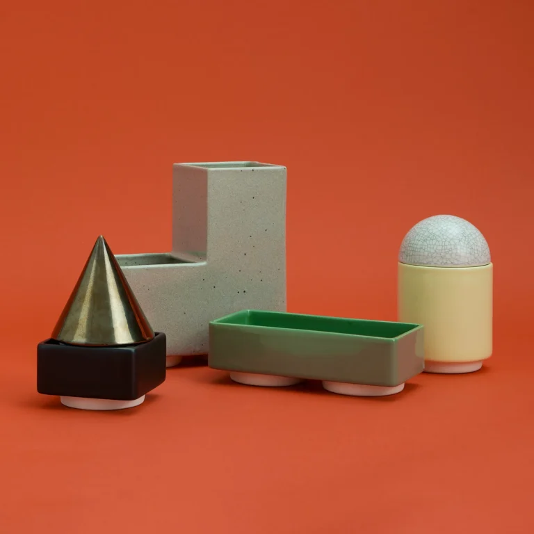 Knstrkt Set Of 6 With Large Pieces by Studio Berg, the separate blocks laid out side by side, with a cone and a crackle dome