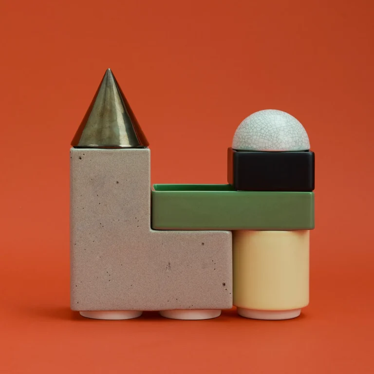 Knstrkt Set Of 6 With Large Pieces by Studio Berg seen from the side, a different stack with the cone atop the greige block