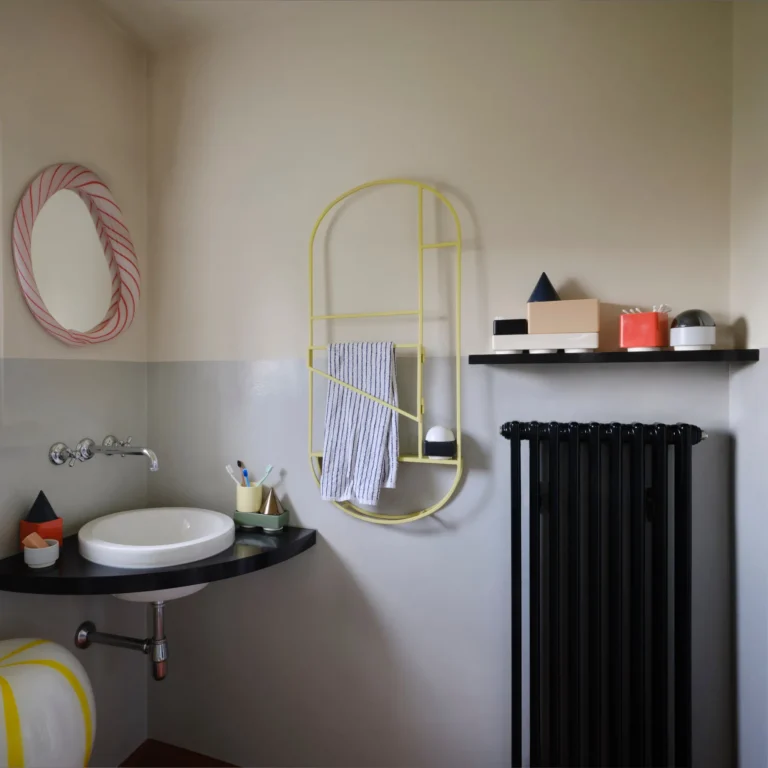 Knstrkt Set Of 14 by Studio Berg in a bathroom, a toothbrush cup by the sink and blocks on a black shelf