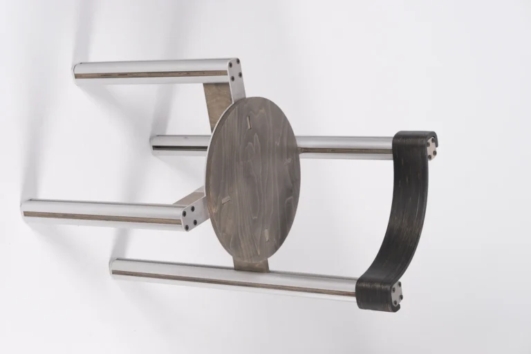 Sigma Chair by 301 Design Studio seen from above and tilted, grey stained round seat, dark backrest and aluminum legs