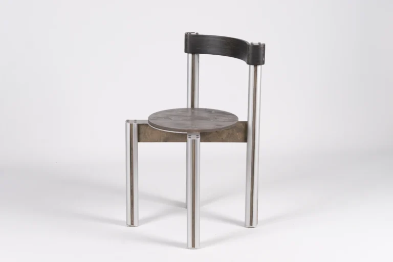 Sigma Chair by 301 Design Studio, grey stained birch seat and dark backrest on aluminum legs, three-quarter view