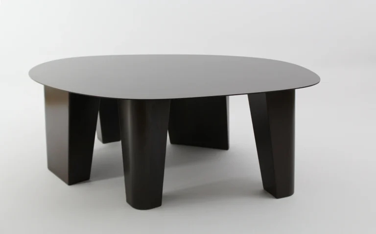 Paris Coffee Table by Vogel Studio, black steel low table with four tapered legs, on a plain light background