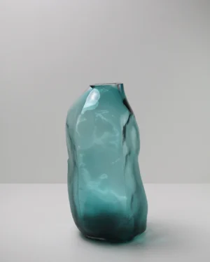 105 Ltr Forms Lagoon Handmade Glass Object by Vogel Studio, teal blown glass vase on a plain background