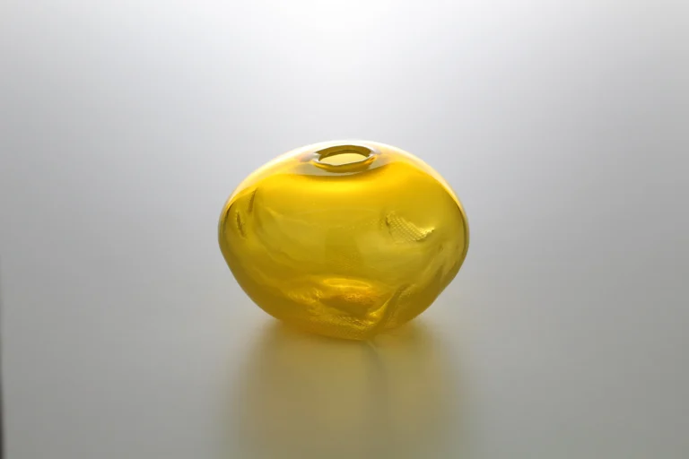 1 2 Ltr Forms by Vogel Studio turned to show deeper creases and a textured patch in the yellow blown glass