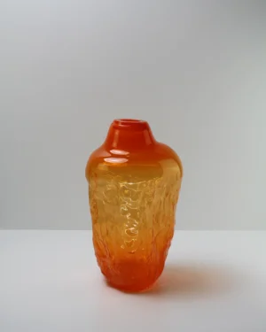 Sand Series Narcissus Handmade Glass Object by Vogel Studio, orange blown glass object, on a plain background