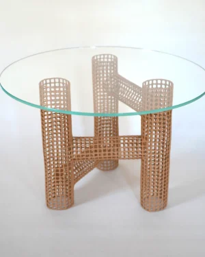 Hera Coffee Table by Dzovag Kotchian, beige perforated ceramic base with round glass top, on a plain background