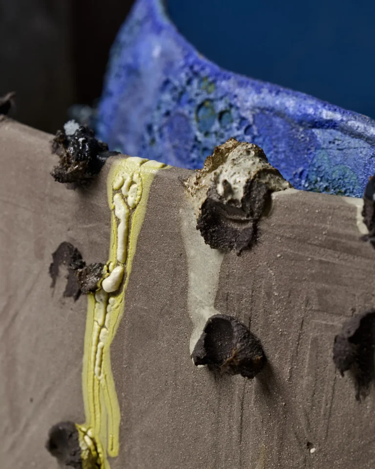 Close-up of the New_love_08 Ceramic Vase's cracked yellow and cream glaze drip and rough clay texture at the rim
